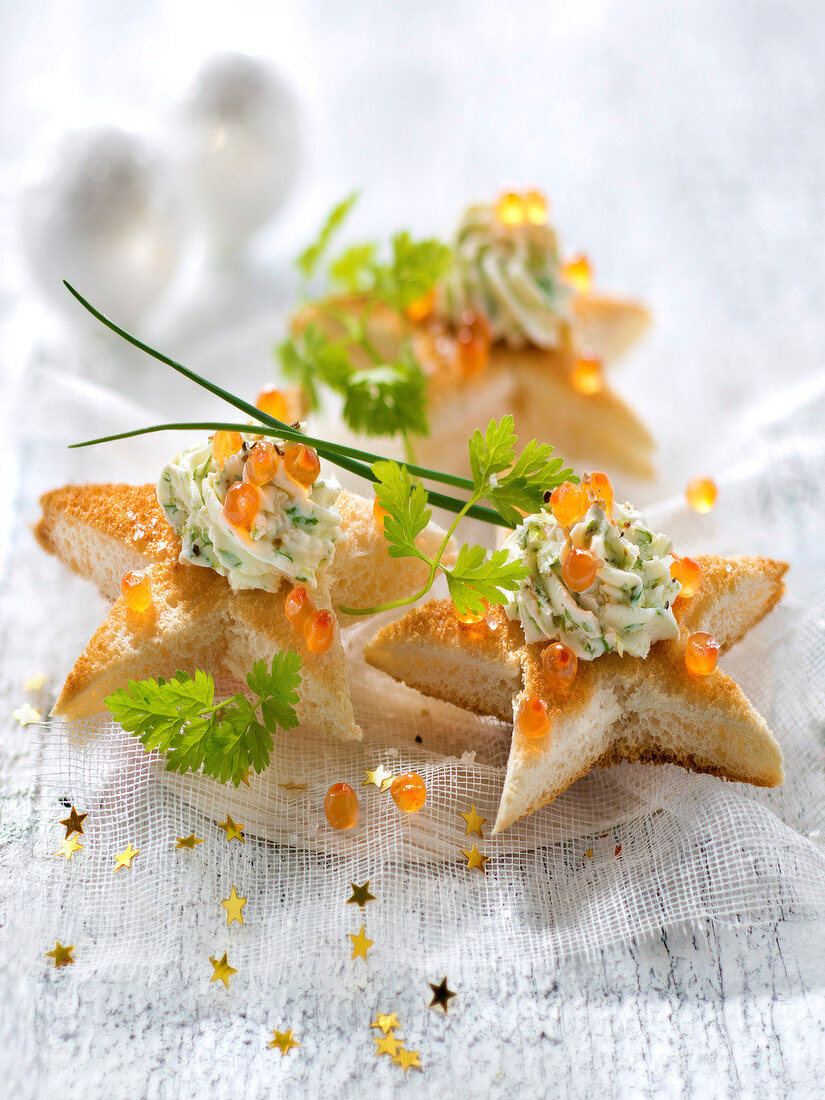 Herb cream cheese and salmon roe star toasts