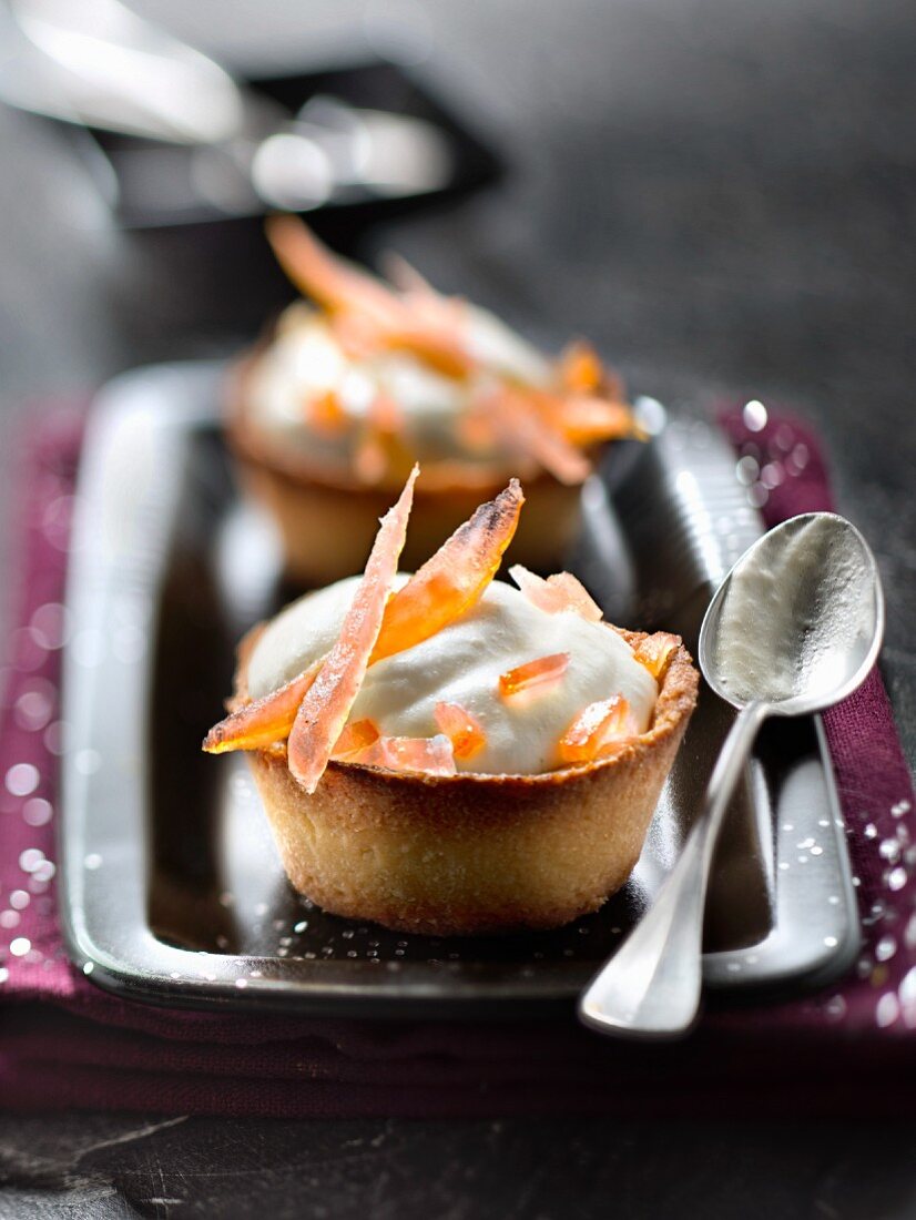 Lemon mascarpone mousse and confit orange rinds in pastry cups