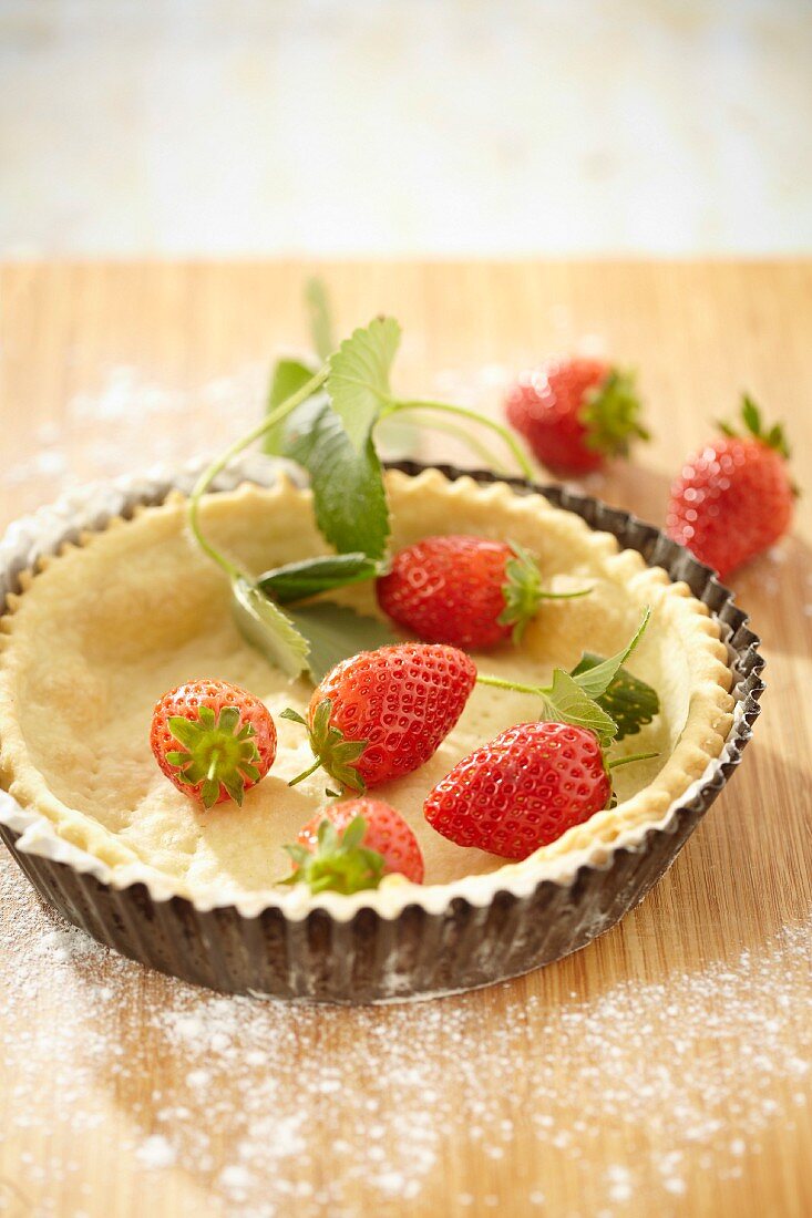 A strawberry tartlet being made