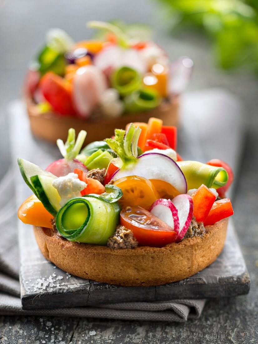 Tapenade and garden raw vegetable tartlets