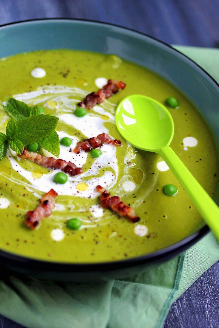 Minty cream of pea soup with diced bacon