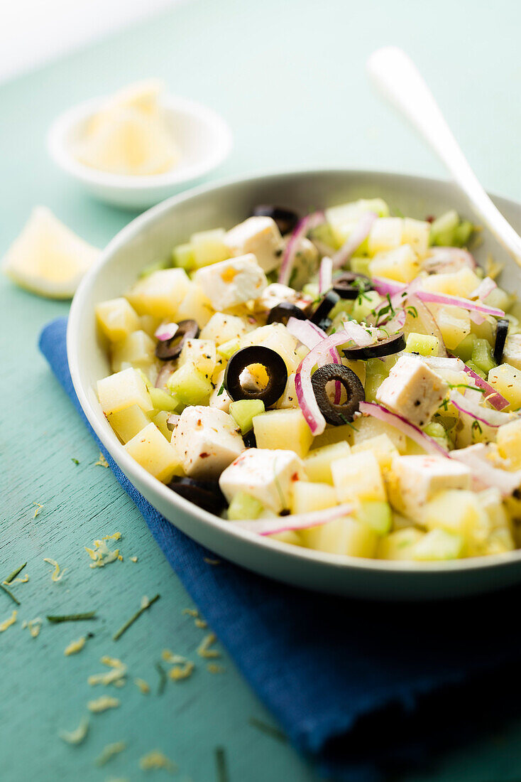 Potato,feta,black olives,red onions and diced cucumber salad