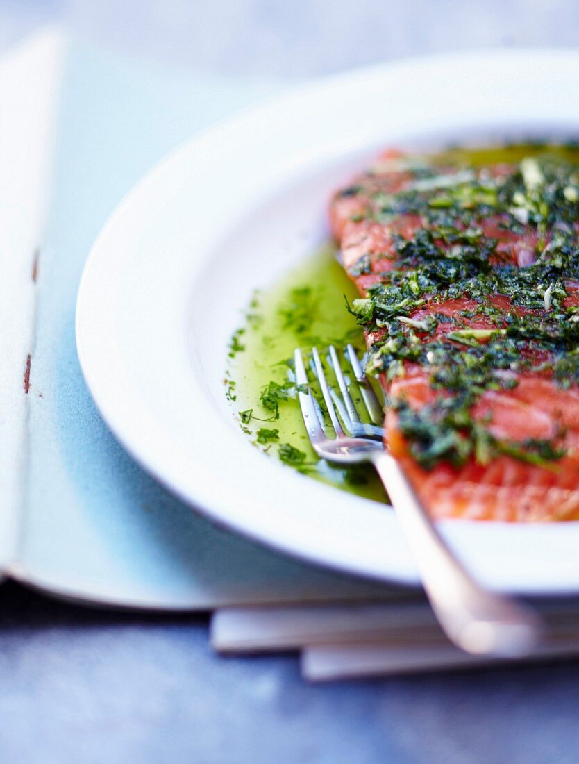 Fresh and raw salmon marinated with basil,dill and olive oil