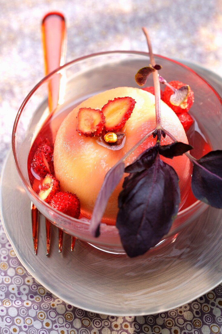 Poached white peach in purple basil and wild strawberry syrup