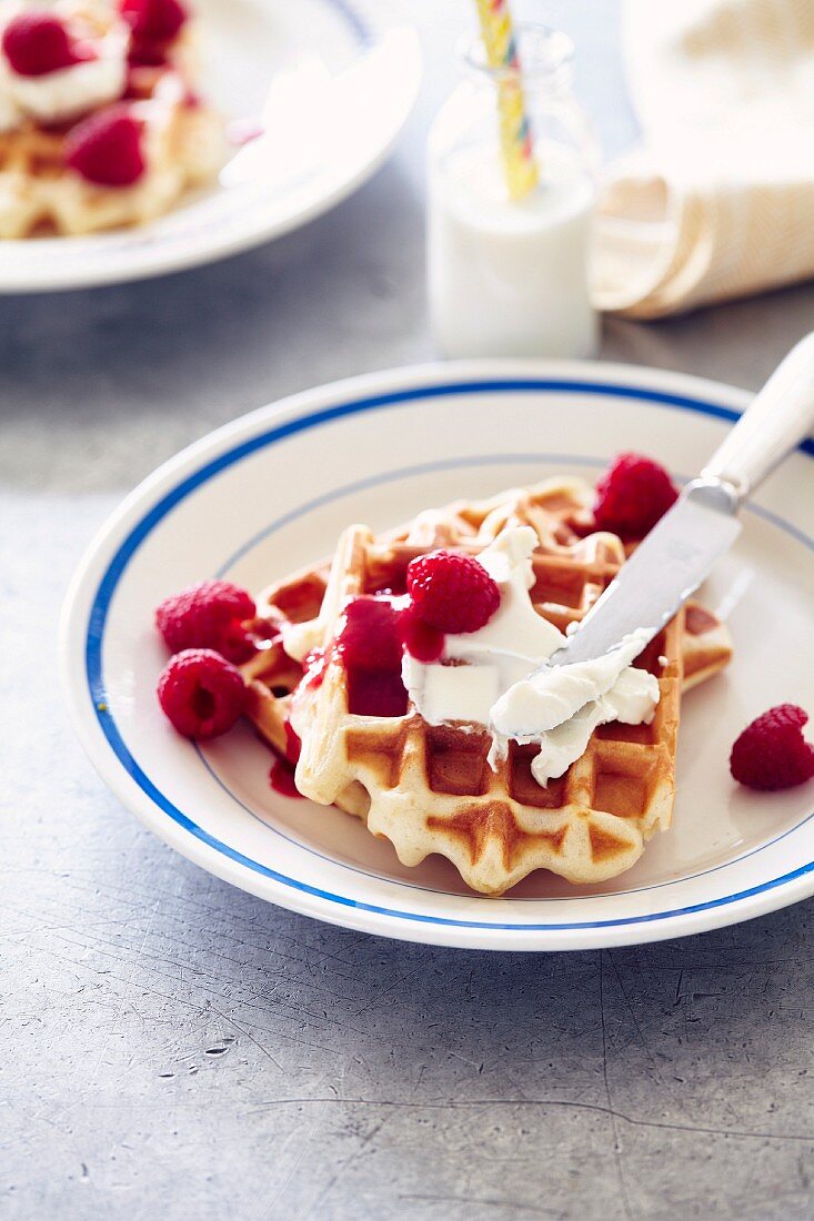 Waffle with cream cheese and raspberries