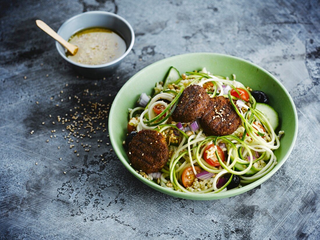 Crushed wheat and vegetable salad with falafels