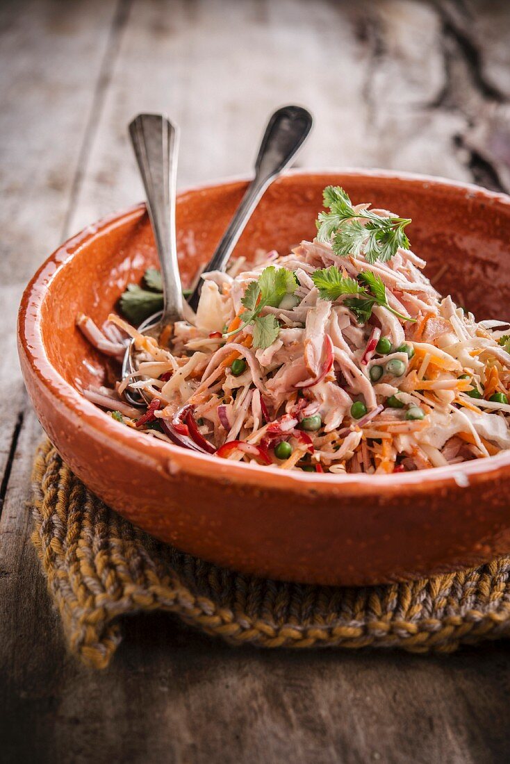 Grated white cabbage and carrot salad with smoked chicken