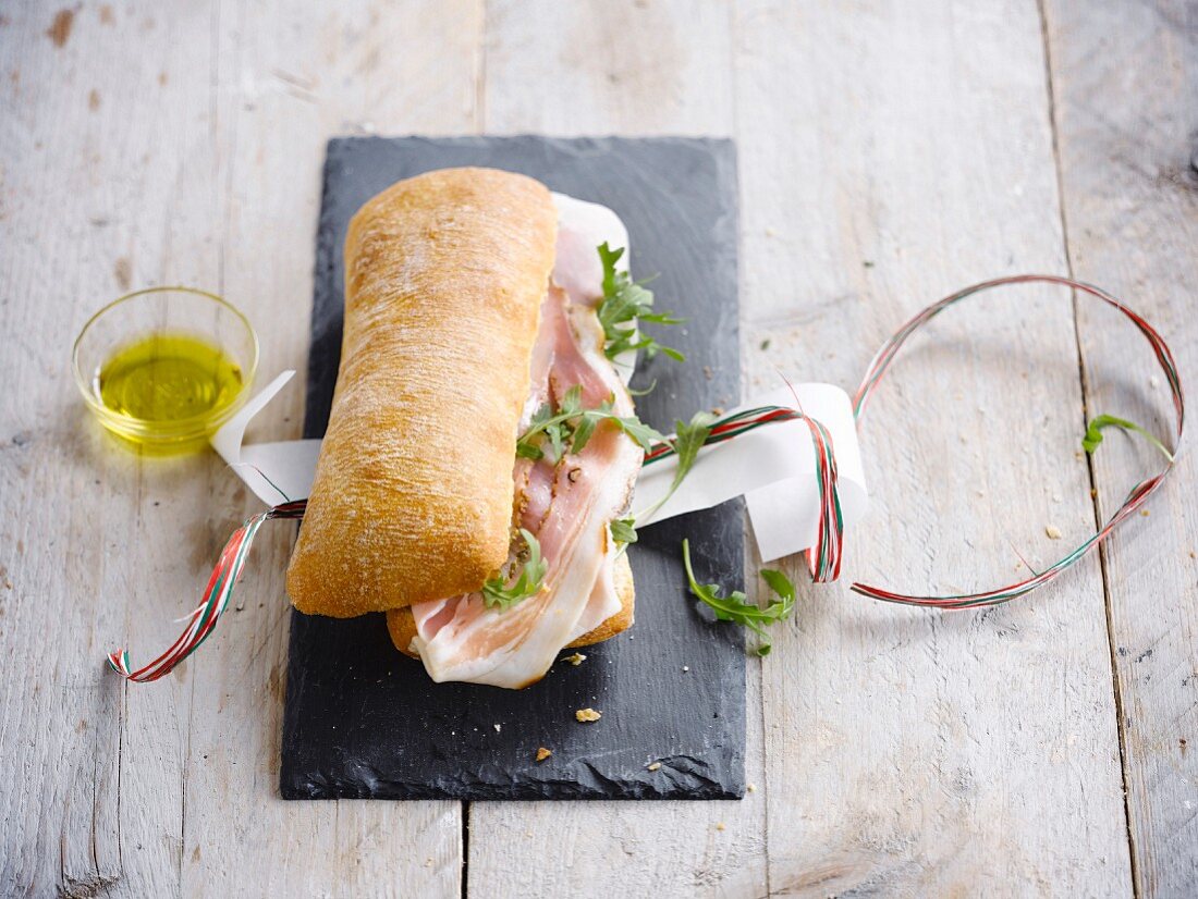 Italian smoked ham and rocket lettuce ciabatta bread sandwhich