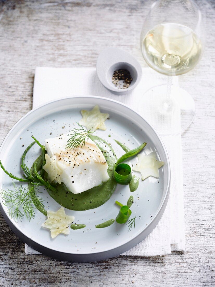 Piece of cod with creamed spinach and leeks,samphires and celeriac stars