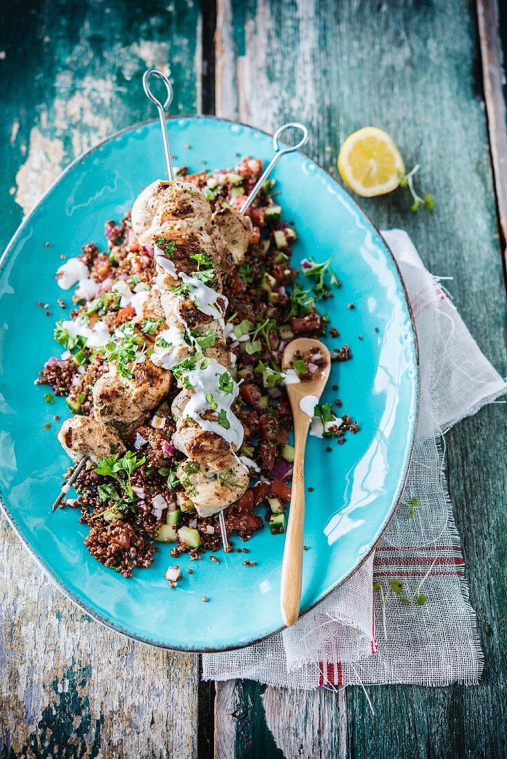 Quinoa tabbouleh with chicken skewers