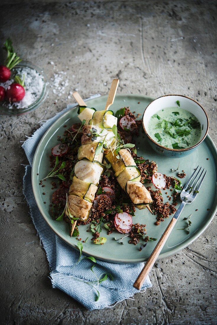 Cod skewers and quinoa salad and radishes