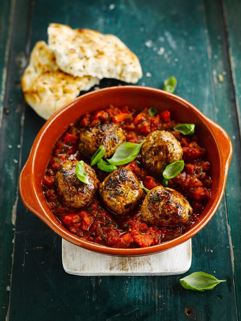 Meatballs in tomato sauce with basil