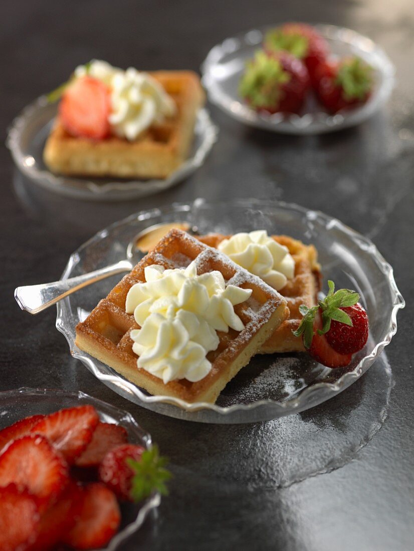 Wafles with whipped cream and strawberries