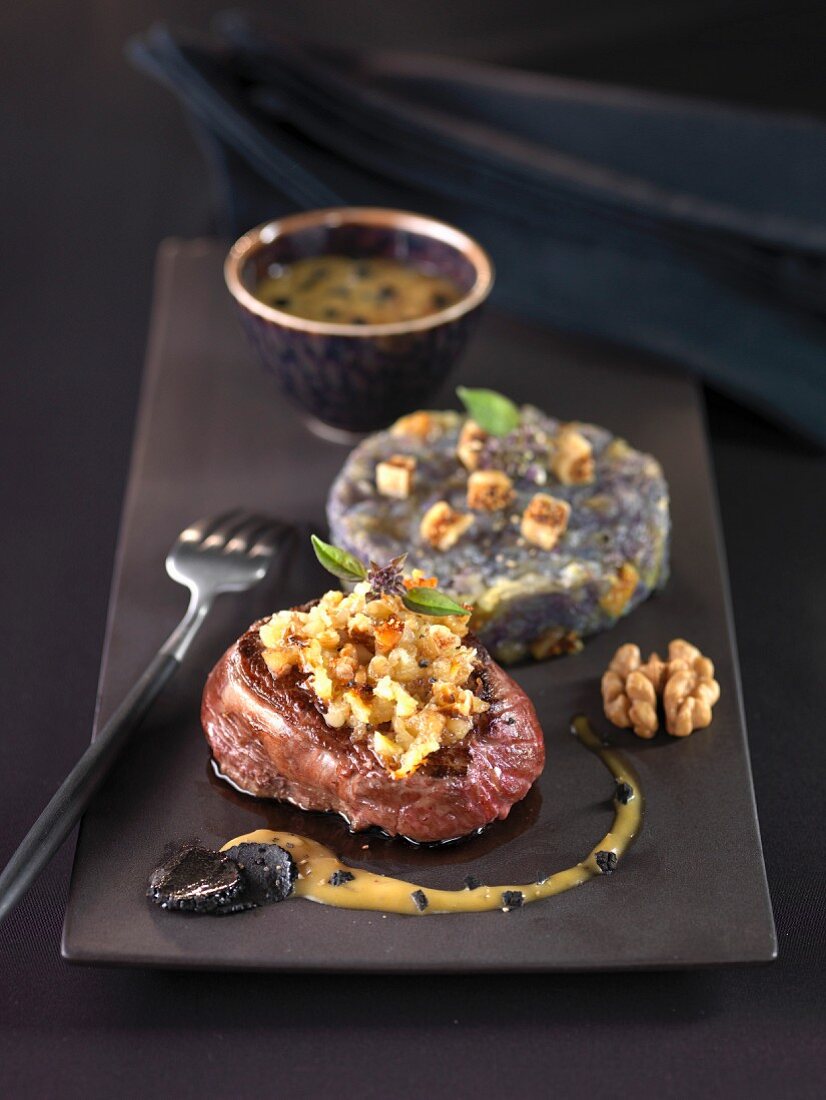 Stag steak with truffle gravy,tender Vitelotte potatoes and figs