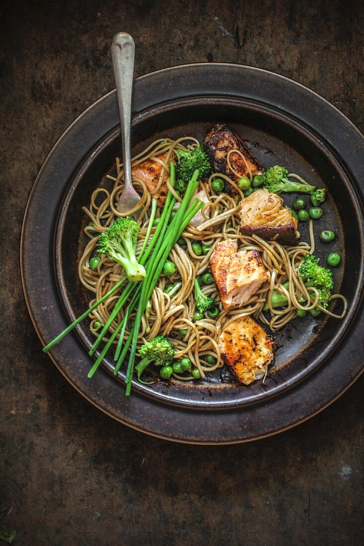 Soba noodles with greens, salmon marinated with soya sauce and honey