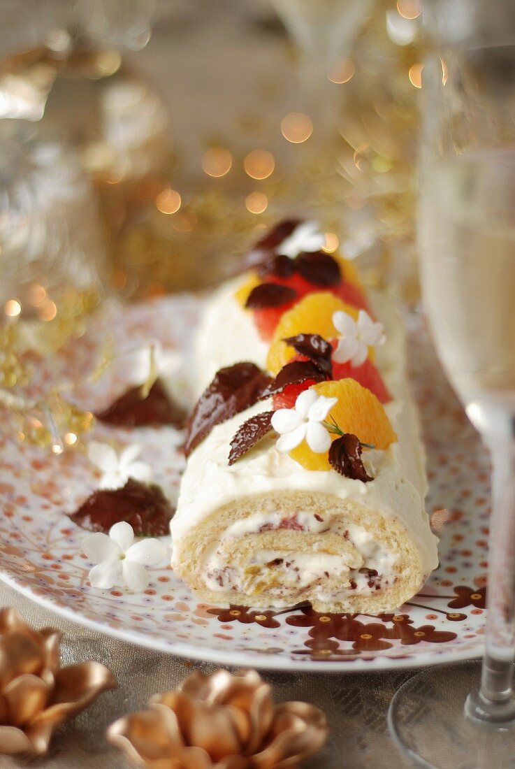 White chocolate,citrus fruit and jasmin Christmas rolled log cake