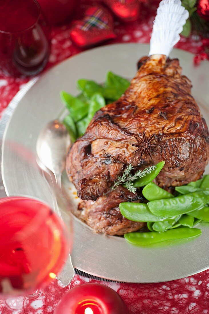 Scottish spicy roasted leg of lamb with sugar peas