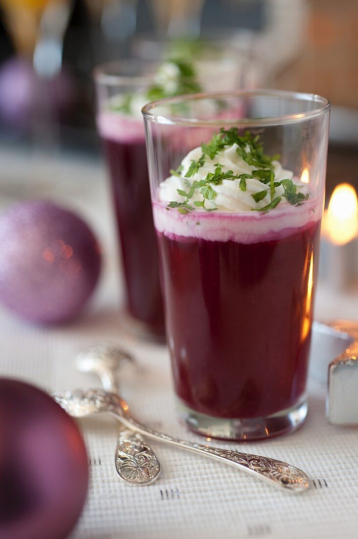 Red cabbage and apple gazpacho with salty whipped cream and fresh herbs