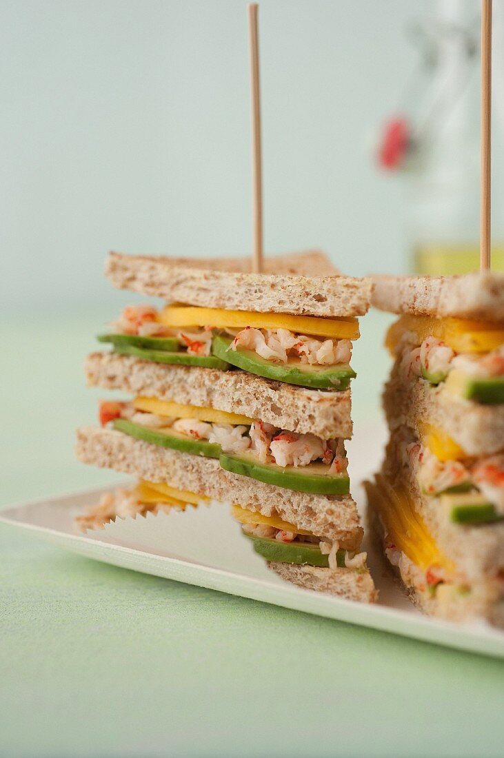 Crab,avocado and mango club sandwich