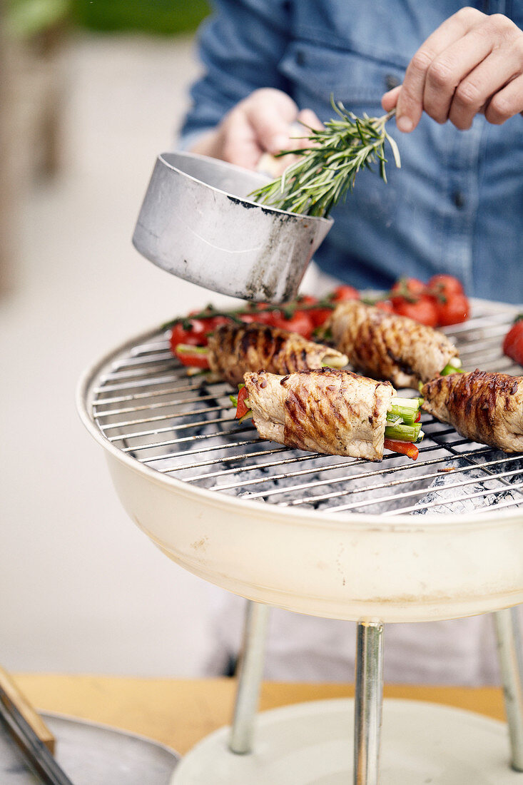 Veal rolls filled with summer vegetables grilled with rosemary sauce