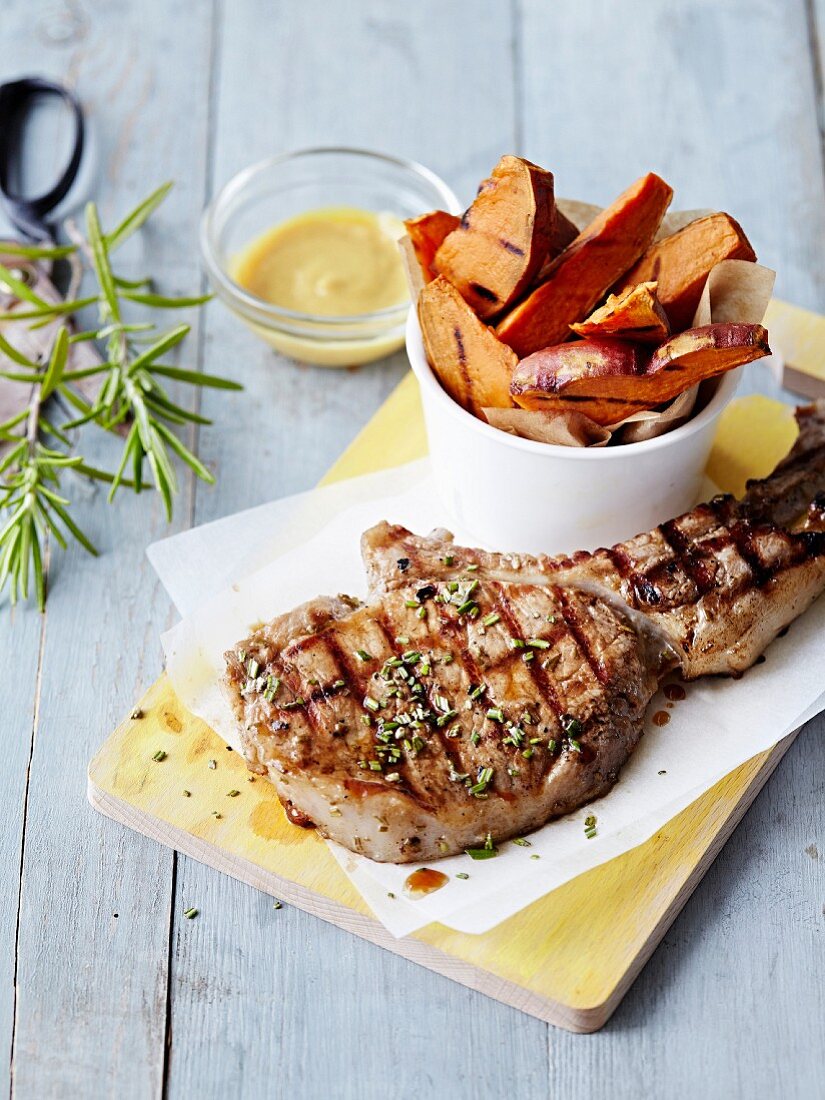 Grilled lamb chop,slices of roasted sweet potatoes