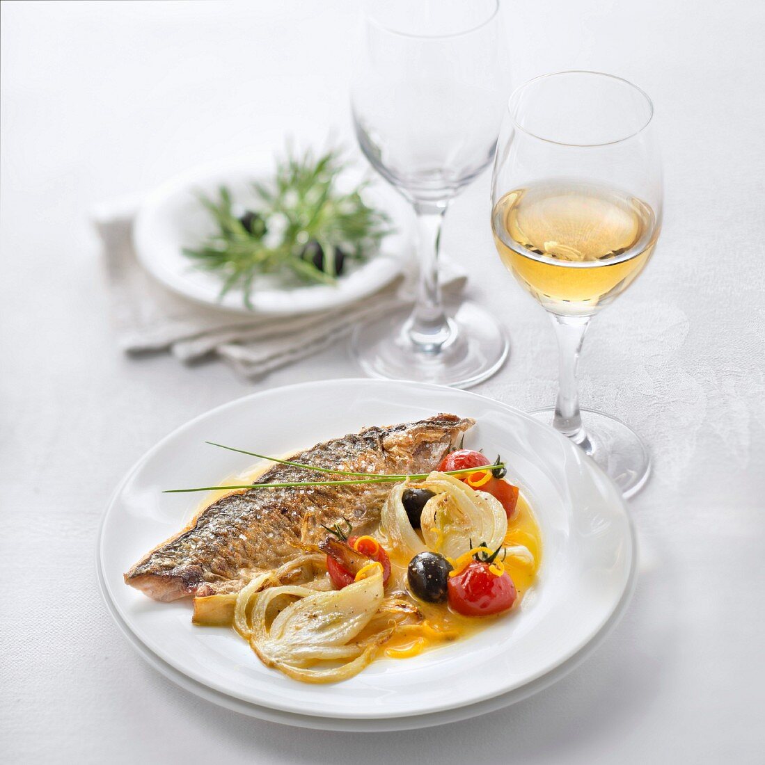 Grilled Mackerel with Fennel, Tomatoes and Olives, Orange Sauce, glass of sweet white wine