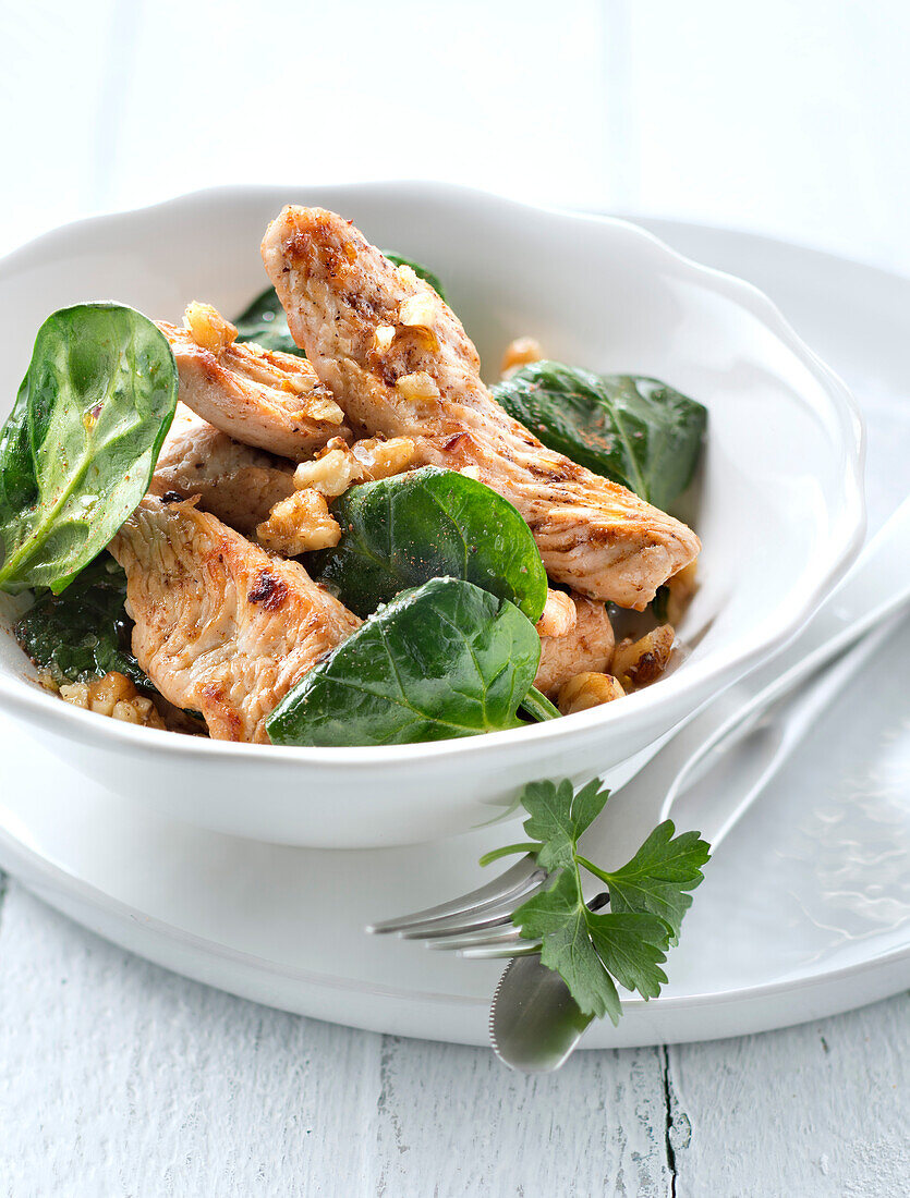 Roast turkey fillets with spinach and walnuts