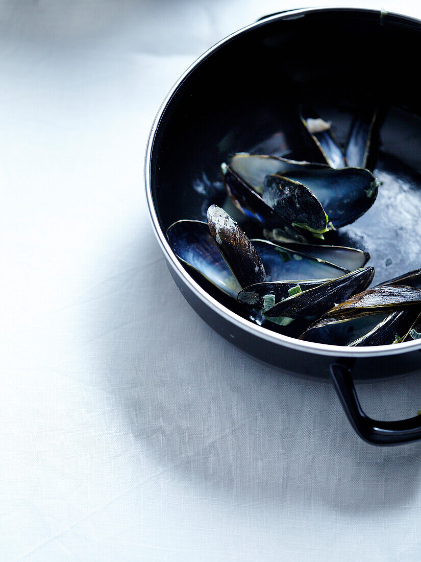 Empty mussel shells in a pot