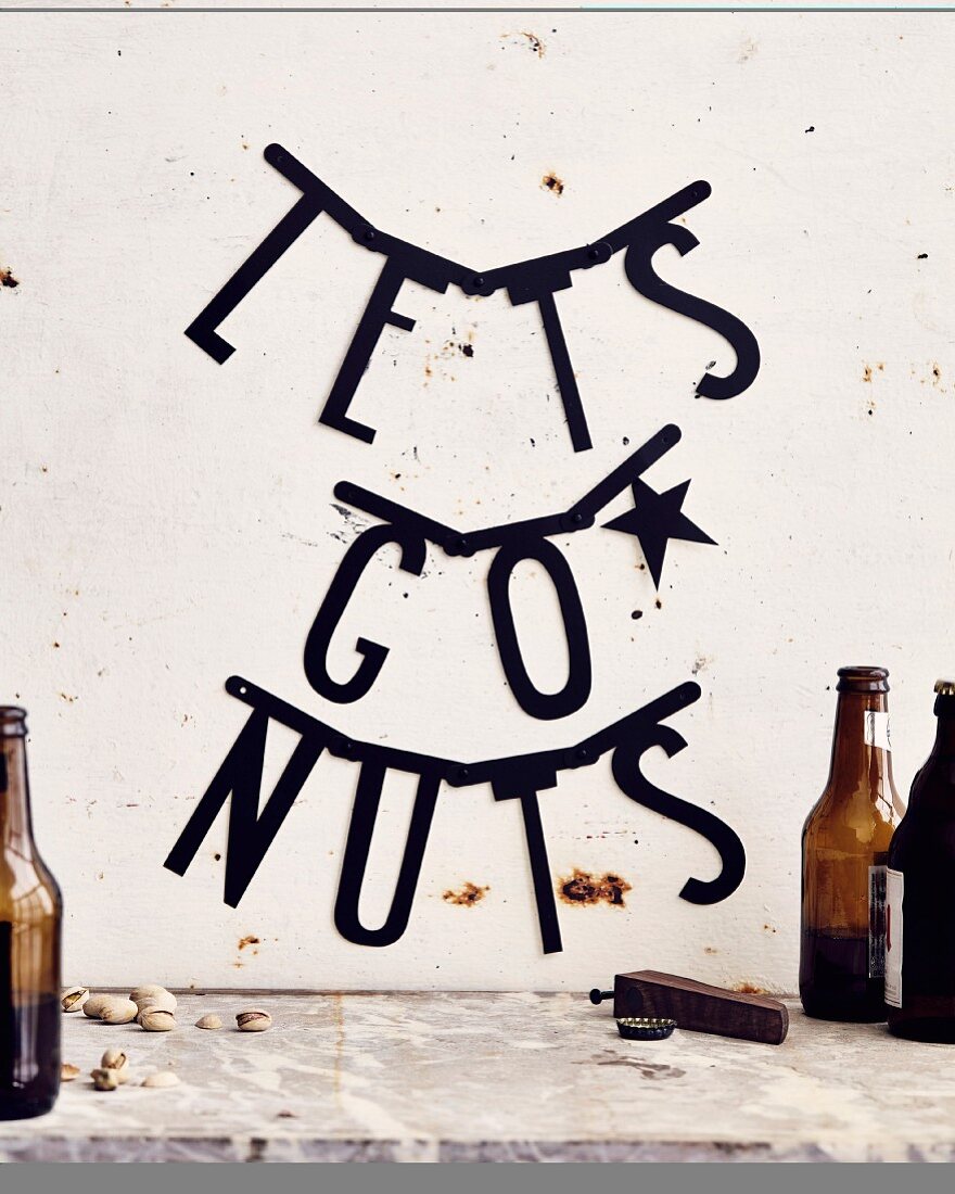 The words 'Let's Go Nuts' written on a wall