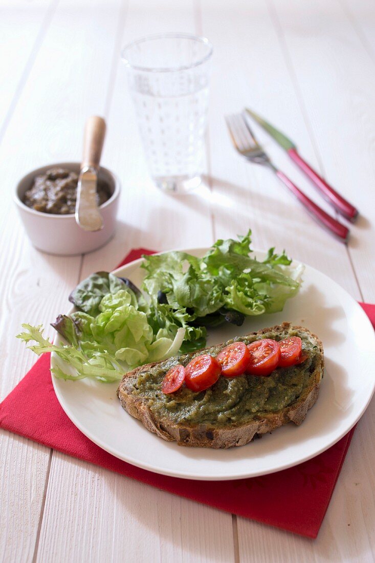 A slice of bread topped with courgette and seaweed spread
