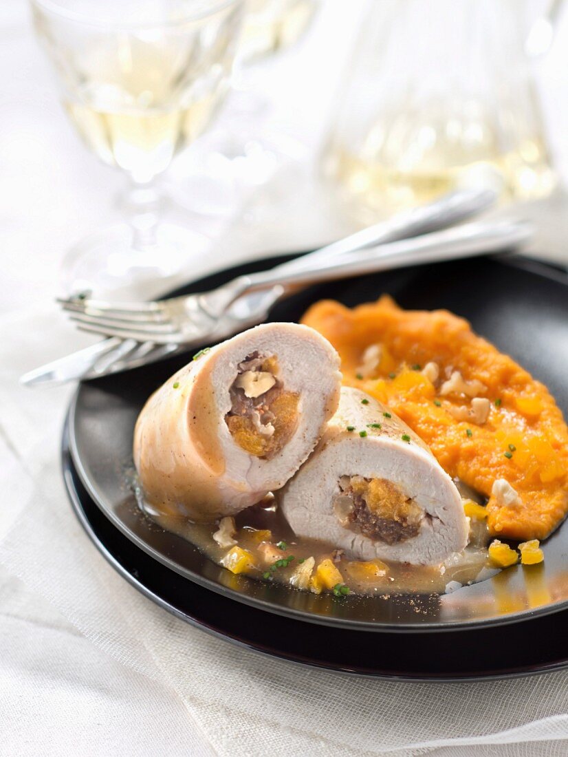 Turkey roulade filled with dried fruit, mashed potatoes and tonka bean sauce