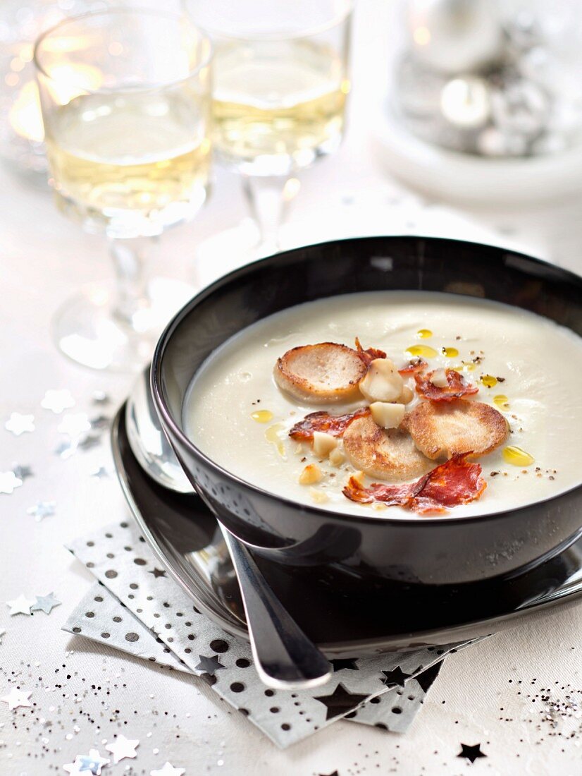 Cream of cauliflower soup with white poultry sausages, chorizo and macadamia nuts