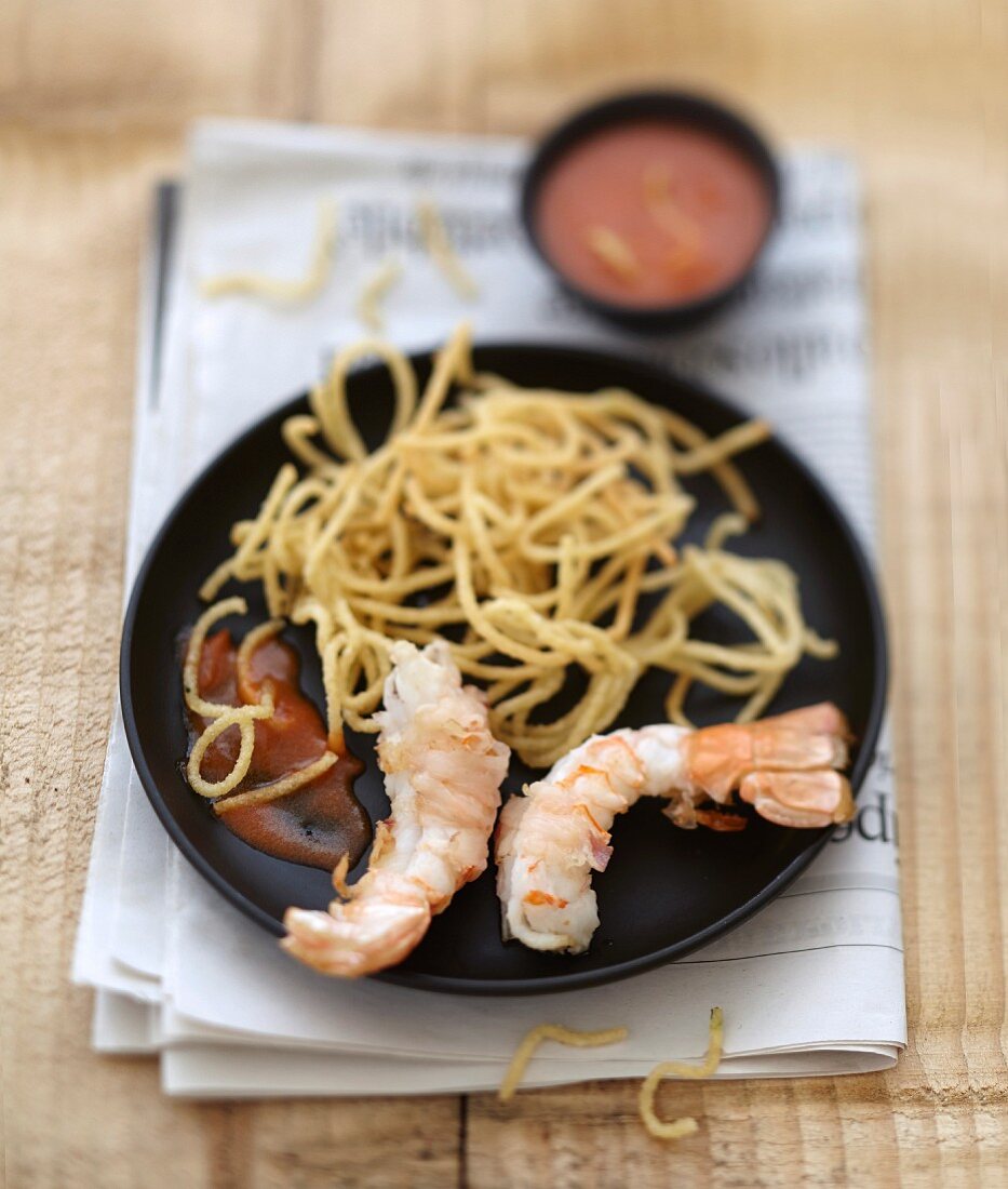 Langoustines grilled with lardo di colonnata and fried spaghettis