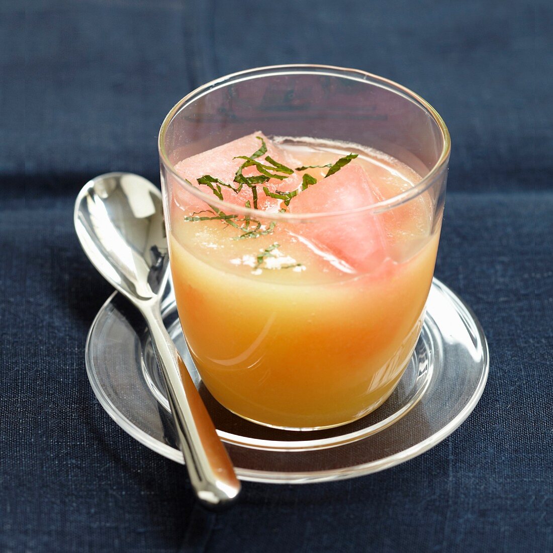 Apple soup with mint and pomegranate ice cubes