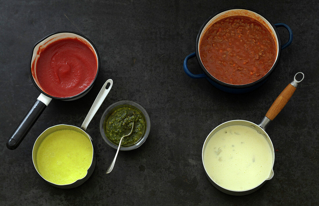 Variety of sauces in saucepans