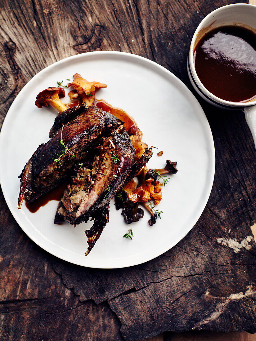 Roasted guinea fowl in red wine with mushrooms
