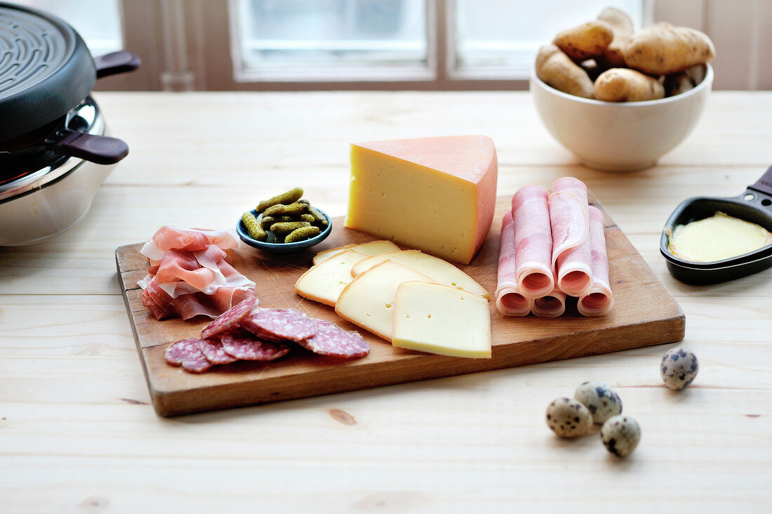 Ingredients and Raclette machine for a dinner