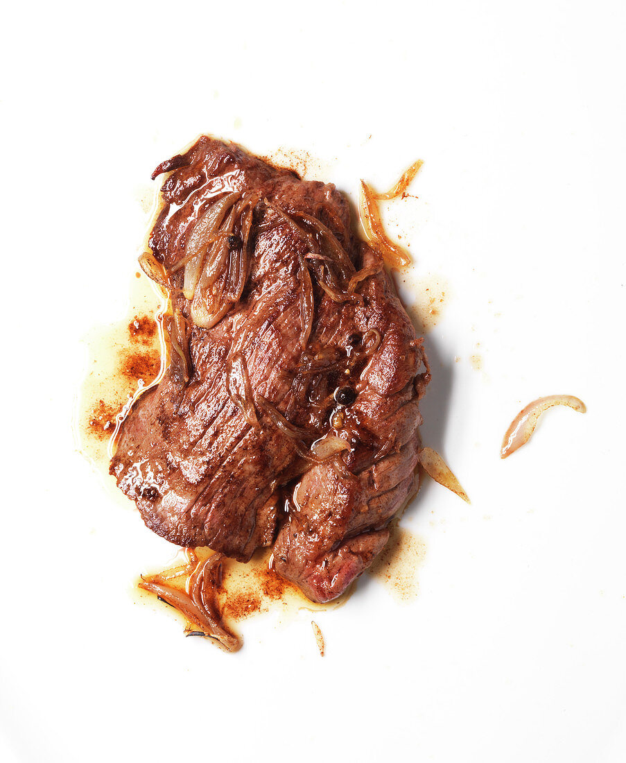 Grilled flank steak with onions and pepper
