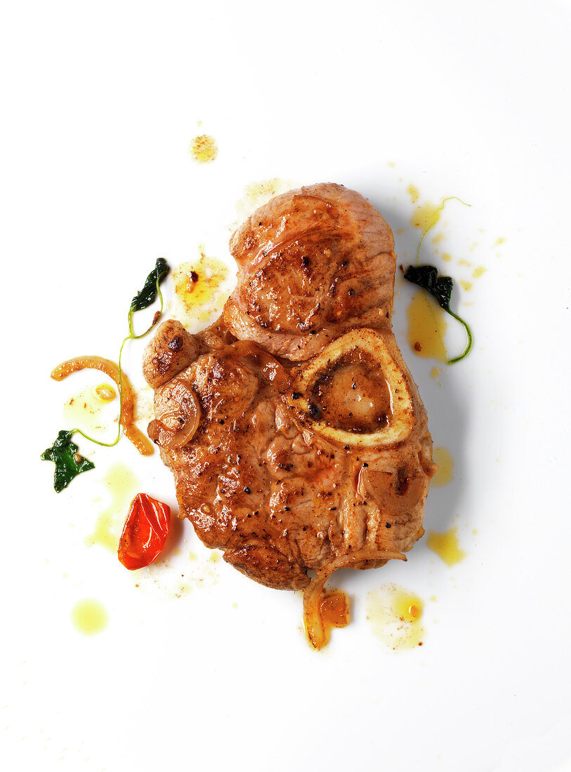 Braised knuckle of veal with onions