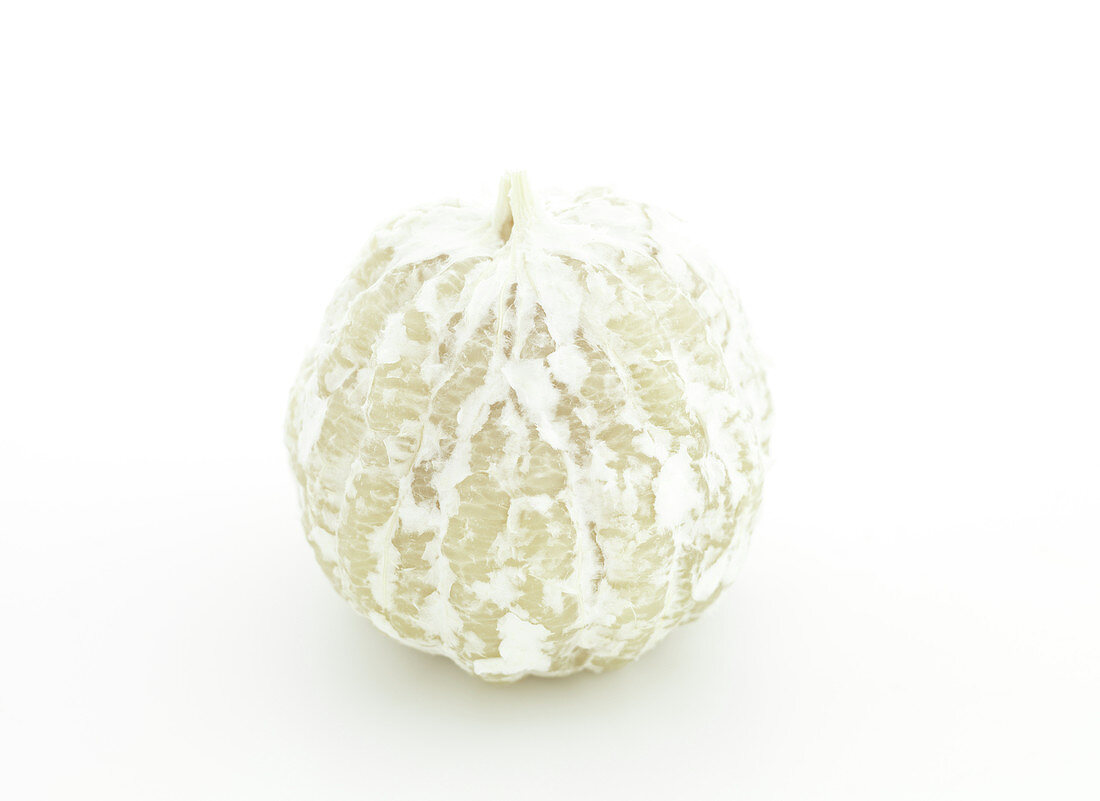 Peeled grapefruit on a white background