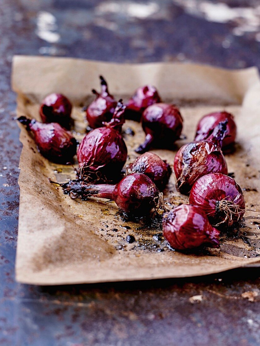 Red onions pickled in balsamic vinegar on wax paper