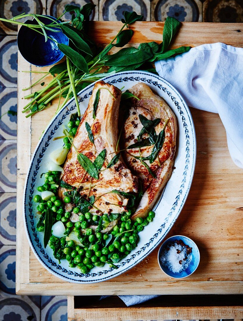 Grilled veal chops, fresh peas with sage