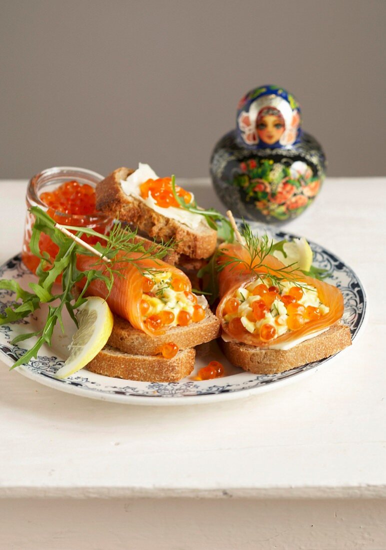 Russian apertif :salmon rolls stuffed with scrambled eggs, fish roe and dill on toasts