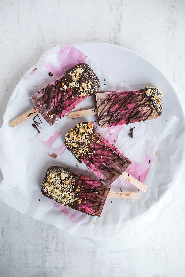 Homemade chocolate and cherry popsicles