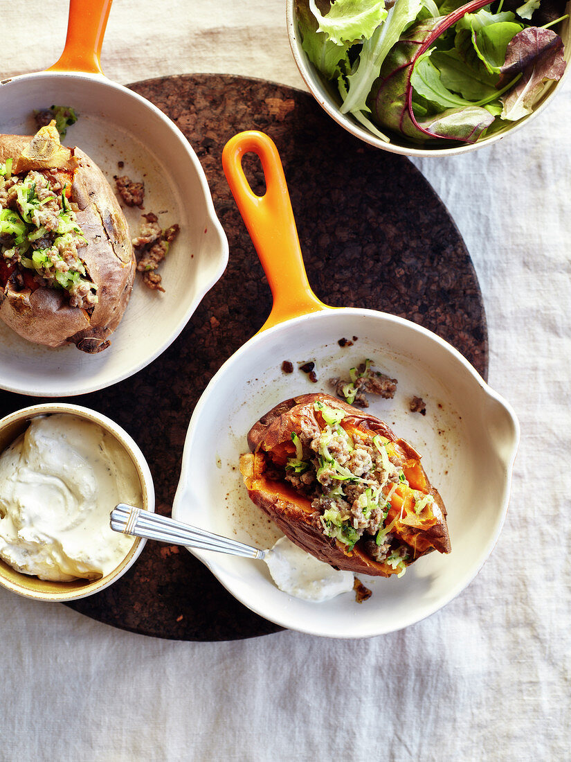 Baked Sweet Potatoes Garnished With Ground Meat And Courgettes