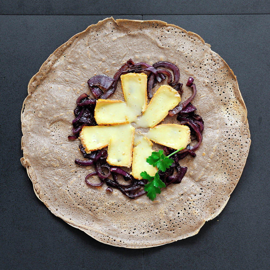 Galette with red onion confit and Livarot cheese