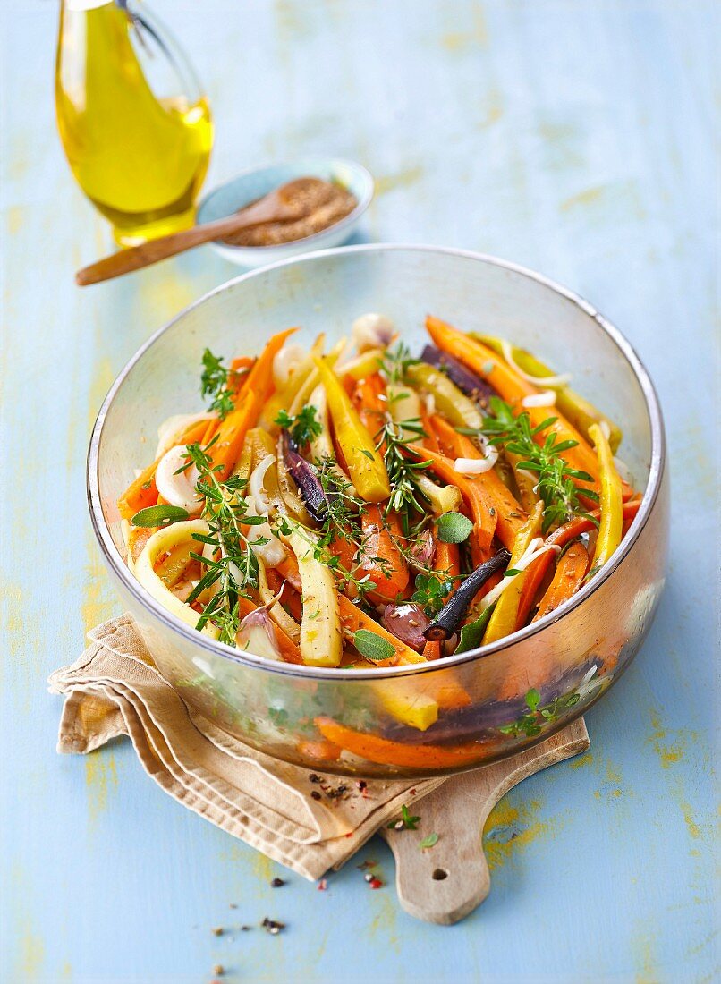 Old-fashioned carrot warm salad with fresh herbs and sesame seeds