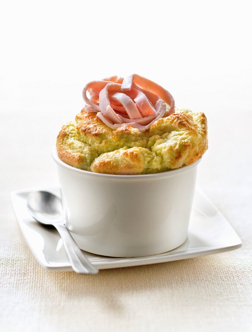 Individual split pea soufflé topped with thin strips of ham