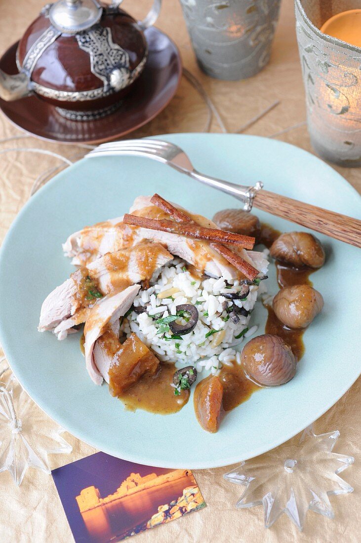 Chicken with chestnuts in cinnamon sauce and rice with black olives for the Lebanese New Year