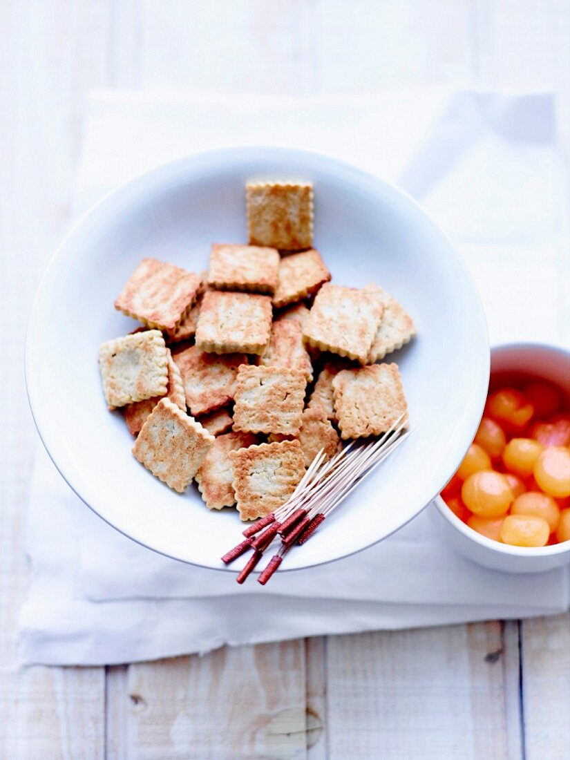 Gluten-free rice and chestnut flour and almond powder rich tea biscuits and melon balls